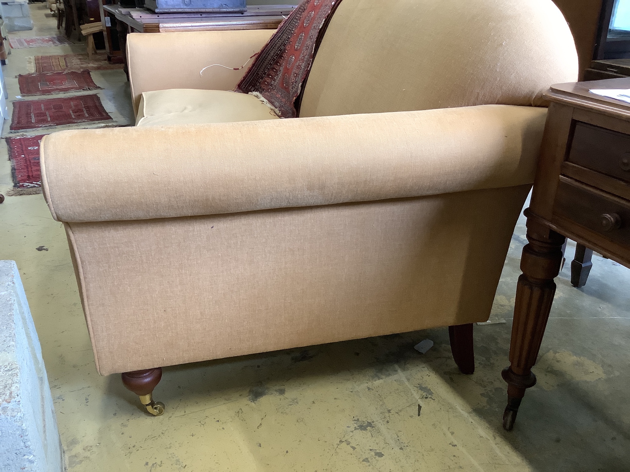 A large modern two seater settee upholstered in beige fabric W-200, D-98, H-94.